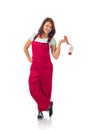 Young happy woman in red overalls with paint roller isolated on white Royalty Free Stock Photo