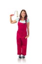 Young happy woman in red overalls with paint roller isolated on white Royalty Free Stock Photo