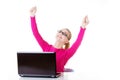 Young happy woman sitting in front of laptop. Royalty Free Stock Photo