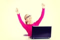 Young happy woman sitting in front of laptop. Royalty Free Stock Photo