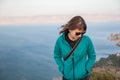 Young happy woman standing above lake, sea. Royalty Free Stock Photo