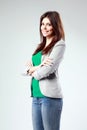 Young happy woman standing with arms folded Royalty Free Stock Photo