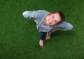 Young happy woman standing in green grass Royalty Free Stock Photo