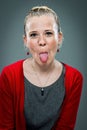 Young Happy Woman Sticking Out Her Tongue