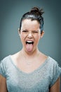 Young Happy Woman Sticking Out Her Tongue Royalty Free Stock Photo