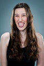 Young Happy Woman Sticking Out Her Tongue Royalty Free Stock Photo