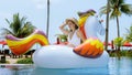 Young happy woman on summer vacation in tropical resort. Travel girl or influencer relax and sunbathing on big Royalty Free Stock Photo