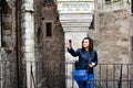 Young happy woman taking a selfie at Corvin Castle, Romania Royalty Free Stock Photo