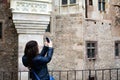 Young happy woman taking a selfie at Corvin Castle, Romania Royalty Free Stock Photo