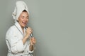 Young happy woman taking a shower and singing Royalty Free Stock Photo