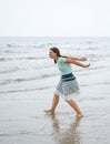 Young happy woman walking on the beach of St.Peter Ording, North Royalty Free Stock Photo