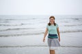 Young happy woman walking on the beach of St.Peter Ording, North Royalty Free Stock Photo