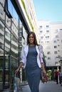 Young happy woman walking street satisfied with shopping bags. Royalty Free Stock Photo