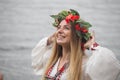 Young happy woman wearing tradisional closes and wreath Royalty Free Stock Photo