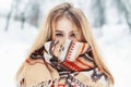 Young happy woman wearing winter cloth. Scarf on the face Royalty Free Stock Photo