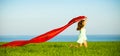 Young happy woman in wheat field with fabric Royalty Free Stock Photo