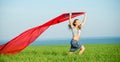 Young happy woman in wheat field with fabric. Summer lifestyle Royalty Free Stock Photo