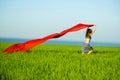 Young happy woman in wheat field with fabric. Summer lifestyle Royalty Free Stock Photo