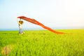 Young happy woman in wheat field with fabric. Summer lifestyle Royalty Free Stock Photo