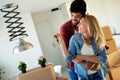 Young married couple with boxes and holding flat keys Royalty Free Stock Photo