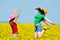 Young happy women on field in summer Royalty Free Stock Photo
