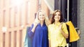 Young and happy women with shopping bags in the city Royalty Free Stock Photo