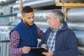 young harbor container depot worker talking to manager