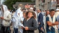 Young hasid pilgrim in the crowd on the city street. Holiday Rosh Hashanah, Jewish New Year.