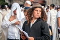 Young hasid pilgrim in the crowd on the city street. Holiday Rosh Hashanah, Jewish New Year.