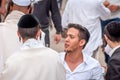 Young hasids pilgrims in the crowd on the city street. Holiday Rosh Hashanah, Jewish New Year.