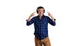 Young with headphones on white background, isolated. People, music, lifestyle. Digital lifestyle concept. Phone earphones.