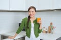 Young healthy asian woman drinking orange juice Royalty Free Stock Photo