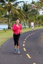 Young healthy asian woman running