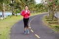 Young healthy asian woman running