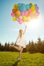 Young healthy beauty pregnant woman with balloons outdoors. A g Royalty Free Stock Photo