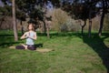 Young healthy caucasian woman doing yoga fitness exercise at Park. Royalty Free Stock Photo