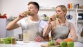 Young healthy couple drinking fresh spirulina smoothie, vitamins and minerals