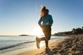 Young healthy lifestyle fitness woman running at sunrise beach Royalty Free Stock Photo