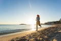 Young healthy lifestyle fitness woman running at sunrise beach Royalty Free Stock Photo