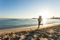 Young healthy lifestyle fitness woman running at sunrise beach Royalty Free Stock Photo