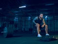 Young healthy man athlete preparing for training in the gym Royalty Free Stock Photo