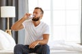 Young healthy man drinking water in morning Royalty Free Stock Photo