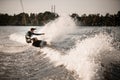 young healthy man rides on wakeboard and falling into the splashing water Royalty Free Stock Photo