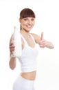 A young and healthy woman with a bottle of milk Royalty Free Stock Photo