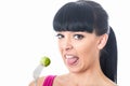 Young Healthy Woman with Disgusted Expression with Distaste to a Brussels Sprout on a Fork
