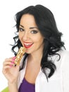 Young Healthy Woman Eating a Breakfast Cereal Bar Royalty Free Stock Photo