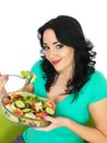 Young Healthy Woman Eating a Fresh Crisp Mixed Garden Salad Royalty Free Stock Photo