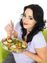 Young Healthy Woman Eating a Fresh Crisp Mixed Garden Salad Royalty Free Stock Photo