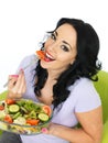 Young Healthy Woman Eating a Fresh Crisp Mixed Garden Salad Royalty Free Stock Photo