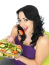 Young Healthy Woman Eating a Fresh Crisp Mixed Garden Salad Royalty Free Stock Photo